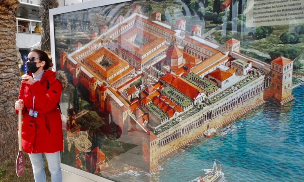 Our excursion guide describes the illustration of the original Roman palace within the walled city of Split.